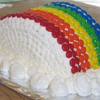 Rainbow Cake I made this for a friends birthday at work she loves rainbows. used 2 round cakes cut them in half stacked them together with frosting to...