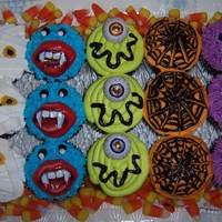 Scary Cupcakes these cupcakes were to go along with a pumpkin cake I made for a halloween themed birthday they are super cute . chocolate cupcakes with...