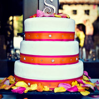 Bright Colors & Happy Times This is a cake for another friend. She wanted a clean simple cake with bright pink and orange. I attached two different color ribbons to...