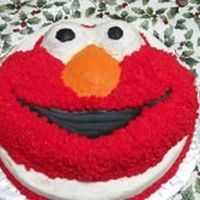 Elmocrabillsmall.jpg 3 year old Elmo fan! Buttercream with yellow cake! I used a 12 inch round with Wilton's elmo pan placed on top!
