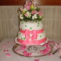 Dot Cake This cake was made for a friend. It is covered in fondant with real flowers used as a topper.