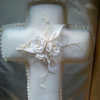 White Cross Cake With Flowers White Cross Cake with gumpaste roses and peace lillies.