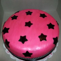 Starry Eyes Pink fondant with black stars...all covered in pearl dust for shimmer.
