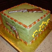 Guns, Bullets, & Badges Cake Made for a Lt. transferring at my husband's job. I had badges made in gold, but my husband really wanted the bright yellow ones...