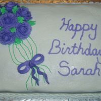 Birthday Cake White cake with almond flavored buttercream icing. All decorations made with buttercream.