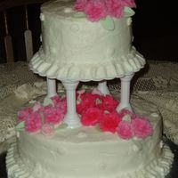 Wilton Course 3 Final Cake White cake with almond flavored buttercream icing. Fondant roses and leaves. Fondant blossoms with buttercream centers. Buttercream borders...