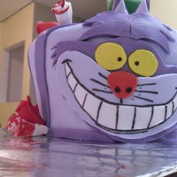 Cheshire Cake Made for a little girl's Tea Party birthday. Lemon cake with Fondant decorations.