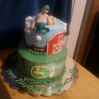 John Deere Cloud Nine Cake John Deere emblem free handed, boy turned nine so he was sitting on cloud nine while resting against a hay bale. He loved it.