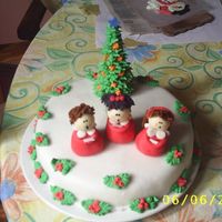 Singing this cake had fondant the children are made of fondant to and the treeis made of icing hope all of u like it