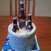 Bud Light Cake 99.9% of the cake is edible. The labels and the caps came from actual Bud Light bottles, those are the only inedible things.