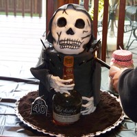Grim Reaper Cake This cake was made for my uncles' 40th birthday party. EVERYTHING is edible except the labels on the cake. (including the bourbon...