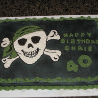 Pirate Birthday Buttercream frosting airbrushed black with a hand drawn buttercream pirate.
