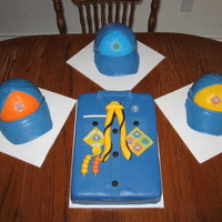 Cub Scout Uniform White cakes, iced in buttercream, covered in fondant, fondant details