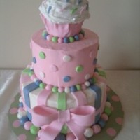 Cupcake 1St Bday Friend wanted this cake off a picture from Sweet Cakes by Rebecca for her daughter's first birthday party. Fondant accents and carved...