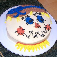 Scarecrow Cake I got the idea for this cake from this website. Thank you! It's just a simple round cake with buttercream filling and decorations.