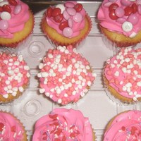 Valentine's Yellow butter cake cuppies with pink bc frosting.