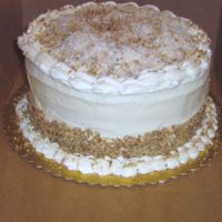 Italian Cream Cake Italian Cream cake with cream cheese icing and cocunut spinkles on top.