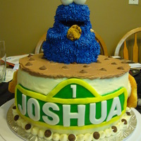 Cookie Monster 8" strawberry cake with strawberry cream filling. Used the mini bear pan from Wilton. My cousin originally wanted cookie monster...