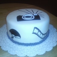 Photographer Cake Covered with fondant and some hand painted details.
