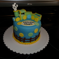 Train Baby Shower Cake Blue and white cake layers inside covered in marshmallow fondant with gumpaste train and buttons.