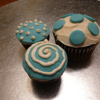 Blue And White Fondant Covered Cupcakes This order was for monochrome cupcakes - the customer didn't want all of them to match. So I took some leftover blue MMF and white BC...