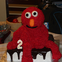 Elmo Cake Made this cake for my sons 2nd bday. The head, arms, and legs are RKT. I did not cover them in fondant and it fell apart right before it...