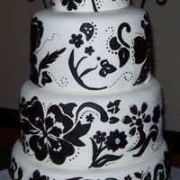 Black & White Parisian Wedding Cake First tier is a single layer, rest of the tiers are 3-layers each, flavor for all tiers is Red Velvet with Cream Cheese Filling and...
