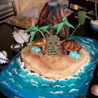 Volcano Cake This was a cake I did for a Luau Party. The Volcano was erupting smoke when we added dry ice and water. Volcano was made of cake covered...