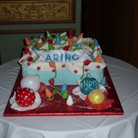 Tangled Christmas Lights This was a cake I made for a Company Christmas Party, a box of tangled Christmas Lights with some ornaments waiting to be hung on the tree...