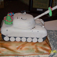 Army Tank Bringing Christmas To The Soldiers This was a cake I made Amry Unity Christmas Party, The tank was Chocolate and Yellow with Buttercream.
