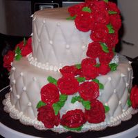 Red Velvet Cake With Red Roses This cake is a Red velvet cake with cream cheese frosting. Covered in White fondant and Red Royal Icing Roses.