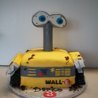 Wall E Wall E cake! a lot of fun to make... I did have trouble figuring out what to use for the eyes and eventually settled on styrofoam with a...