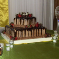 Square Offset German Chocolate Grooms Cake german choc with traditional gc filling and milk chocolate bc. choclate ganace and dipped strawberries.
