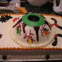 Gross Halloween Cake I did this cake for a friend for Halloween. She wanted it to be really gross looking. I made the sheet cake in the white almond flavor with...