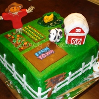 Farm Town WASC with buttercream. Scarecrow and animals are fondant, barn is RKT. Designed to reflect the birthday boy's farm in the online game...