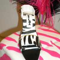 Cake/cupcake Tower shoe/ gum paste/fondant mixture; cake/ lemon w/ lemon marshmallow creme buttercreme covered with fondant