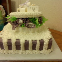 Bridal Shower Cake my first attempt at a hat box cake (i haven't taken out the tissue from the purple fondant folds). bottom layer is golden vanilla cake...