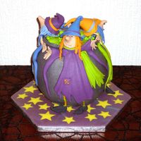 Witches Around A Bubbling Pot This is my first time using fondant to decorate a cake. I used Debbie Browns insturctions and found it to be super easy. The flavor is...