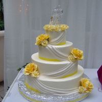 4 Tier Drapes Dummy cake from bridal show, all buttercream with fondant drapes, silk flowers.