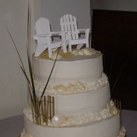 Beach Themed Wedding Cake Wooden adirondack chairs for topper; french vanilla cake, lemon filling, vanilla buttercream, white chocolate shells and sand dollars with...