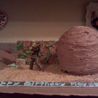 Indiana Jones This cake was for a boys' birthday he loved the Indiana Jones movies so I took the scene where he is running from the giant boulder...