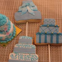 Wedding Cake Cookie Pops I made these for a "wedding favor table" challenge between two planners. Some are Sugar Cookies covered two ways - chocolate or...