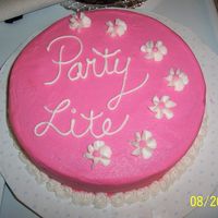 Partylite Round Cake yellow cake, frosted with pink BC, white drop flowers with matching pink dots. Made for a PartyLite candle party I hosted.