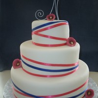 Ribbon Wedding Cake Bride wanted styrofoam bottom tiers and real top tier. Handmade Cala lilies with ribbon covering cake