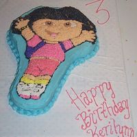 Dora Character Cake White cake with pink coloring added, to make it a pink cake (per my daughter's request), used the Dora character pan. BC icing, star...