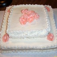 Practice Cake For 50Th Wedding Anniversary Party 2 tier stacked yellow cake, white bc frosting, peach roses, shell border. Tried to do garland on the sides, totally didnt work! LOL