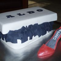 Aldo Shoe Bridal Shower Cake This was my first shoe cake! The shoe is made of gumpaste and dusted with luster dust. The cake is vanilla cake with buttercream frosting...