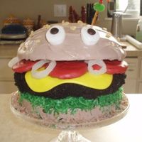 Big Mac Cake I made this cake for a work picnic. It is made of two 8 in round pans and one 2 qt. pyrex bowl for the top bun.