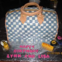 Louis Vuitton Purse Cake My first attempt on a purse cake. Red velvet with raspberry cream cheese filling with MMF details.