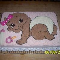 Aniya's Baby Shower Cake Made for a coworker's gift. Baby bottle and pacifier are made of molded chocolate. Hair bow is fabric.